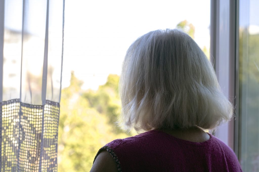 Woman looking outside