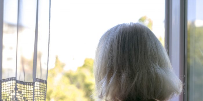 Woman Looking Outside